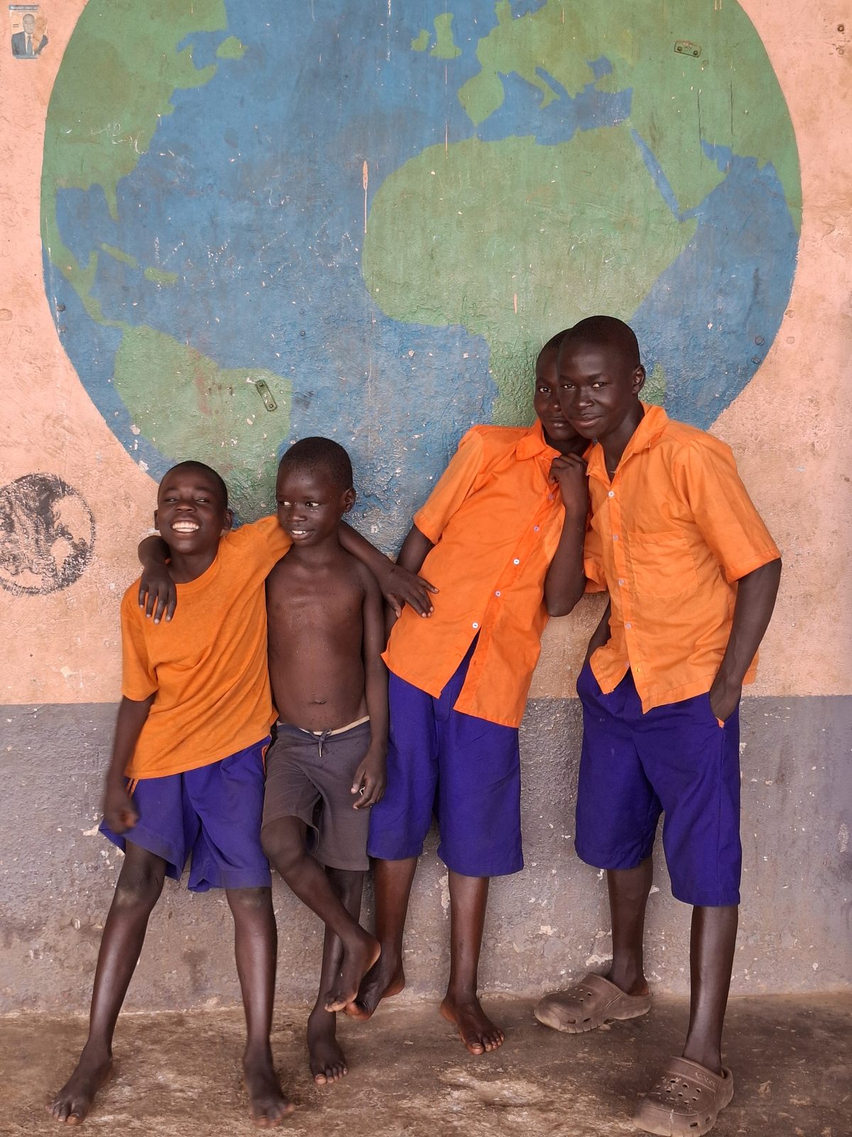 A child supported by Child Restoration Outreach Uganda, safe and hopeful
