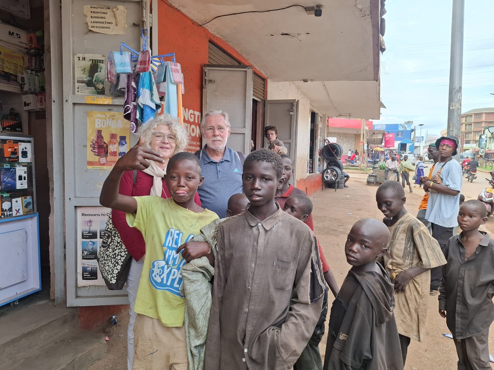 A Child Restoration Outreach Uganda staff member supporting a child